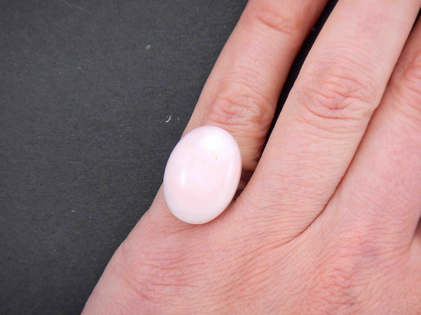 Finger ring with oval natural pink opal stone cabochon, stainless steel adjustable base (US 5-6)