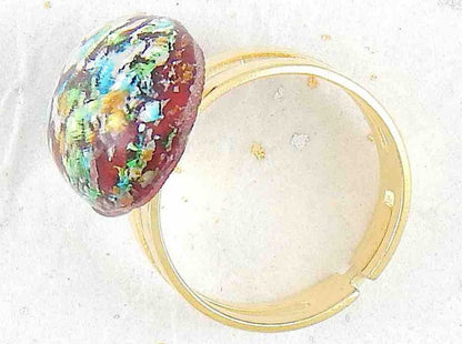 Finger ring with red oval vintage glass cabochon, blue-green-gold-silver speckles, stainless steel adjustable base