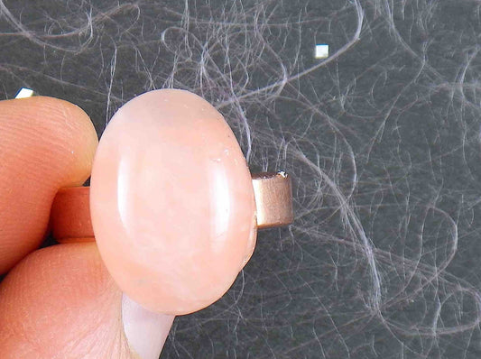 Finger ring with oval natural rose quartz cabochon, soft translucent pink, rose gold-toned adjustable stainless steel base (US 7-8)