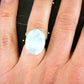 Finger ring with large natural white oval moonstone cabochon, stainless steel adjustable base (US 5-6)