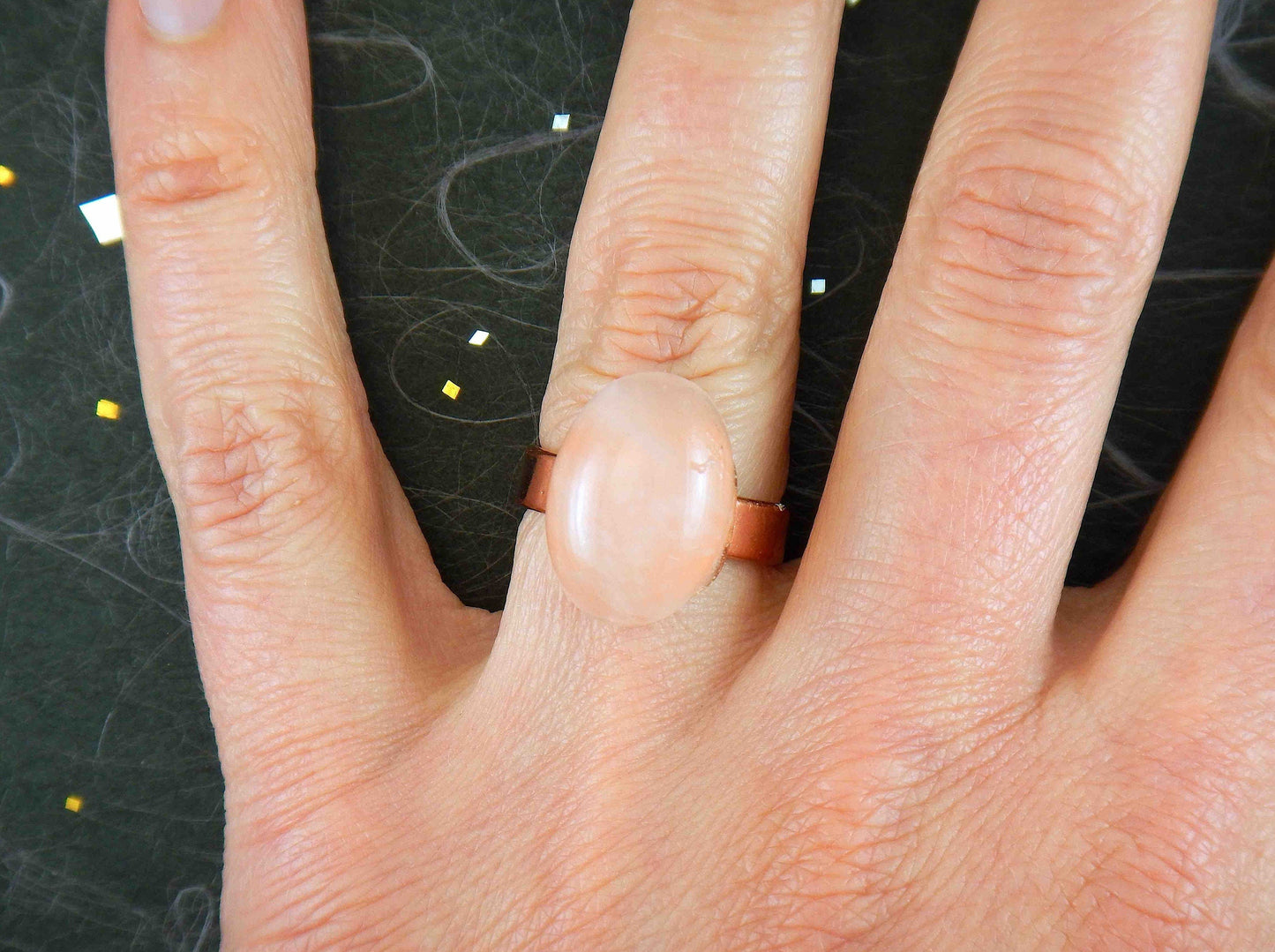 Finger ring with oval natural rose quartz cabochon, soft translucent pink, rose gold-toned adjustable stainless steel base (US 7-8)