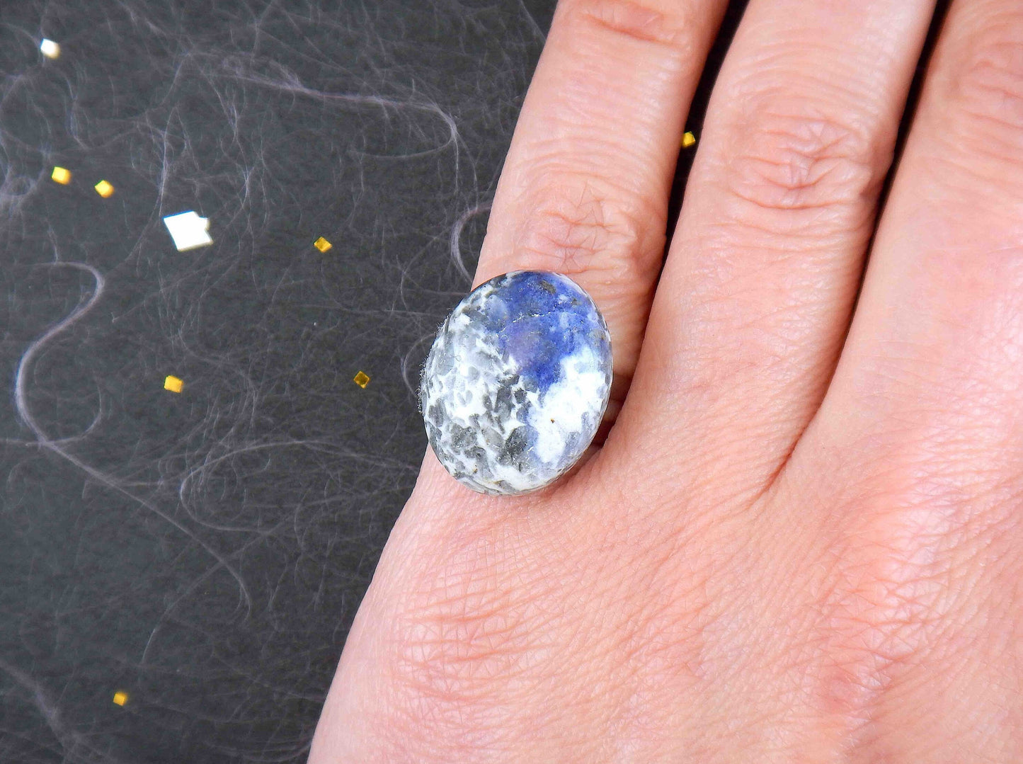 Finger ring with natural sodalite stone cabochon, large oval marbled in blue-grey-white, stainless steel adjustable base (US 5-6)