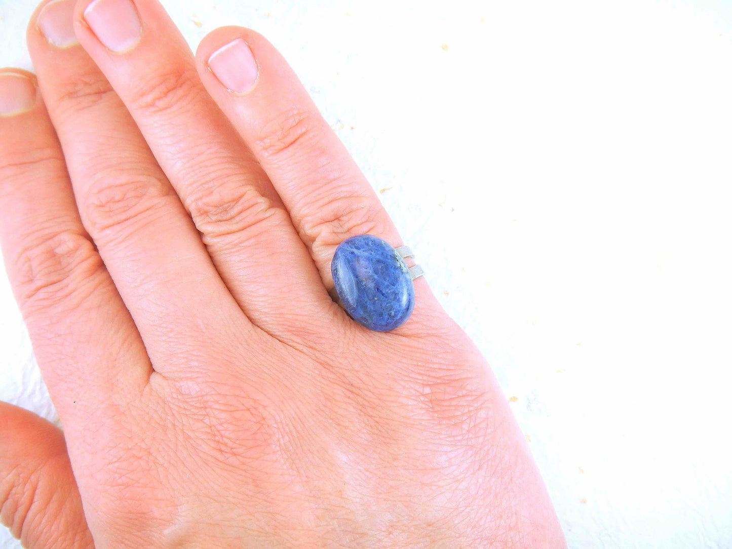 Finger ring with oval natural sodalite cabochon, 2 tones of blue, stainless steel adjustable base (US 5-6)