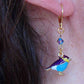 Short earrings with small plump enamelled birds in 2 colours, Swarovski crystals, gold-toned stainless steel lever back hooks