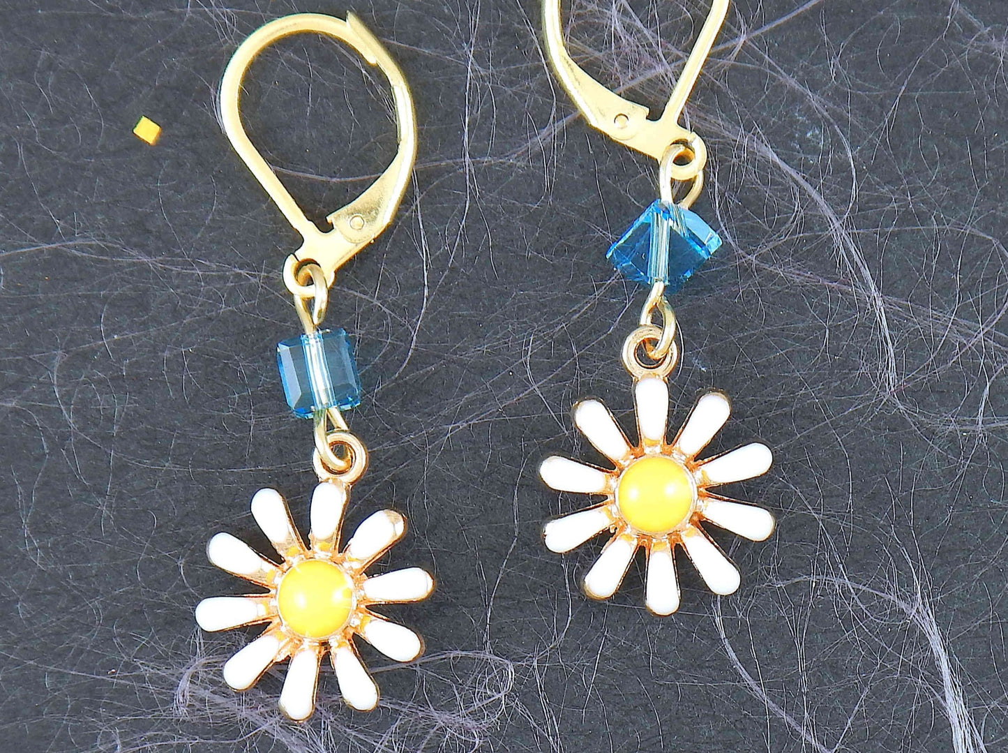 Short earrings with tiny white and yellow enamelled daisies, choice of green-red-blue Swarovski crystals, gold-toned stainless steel lever back hooks