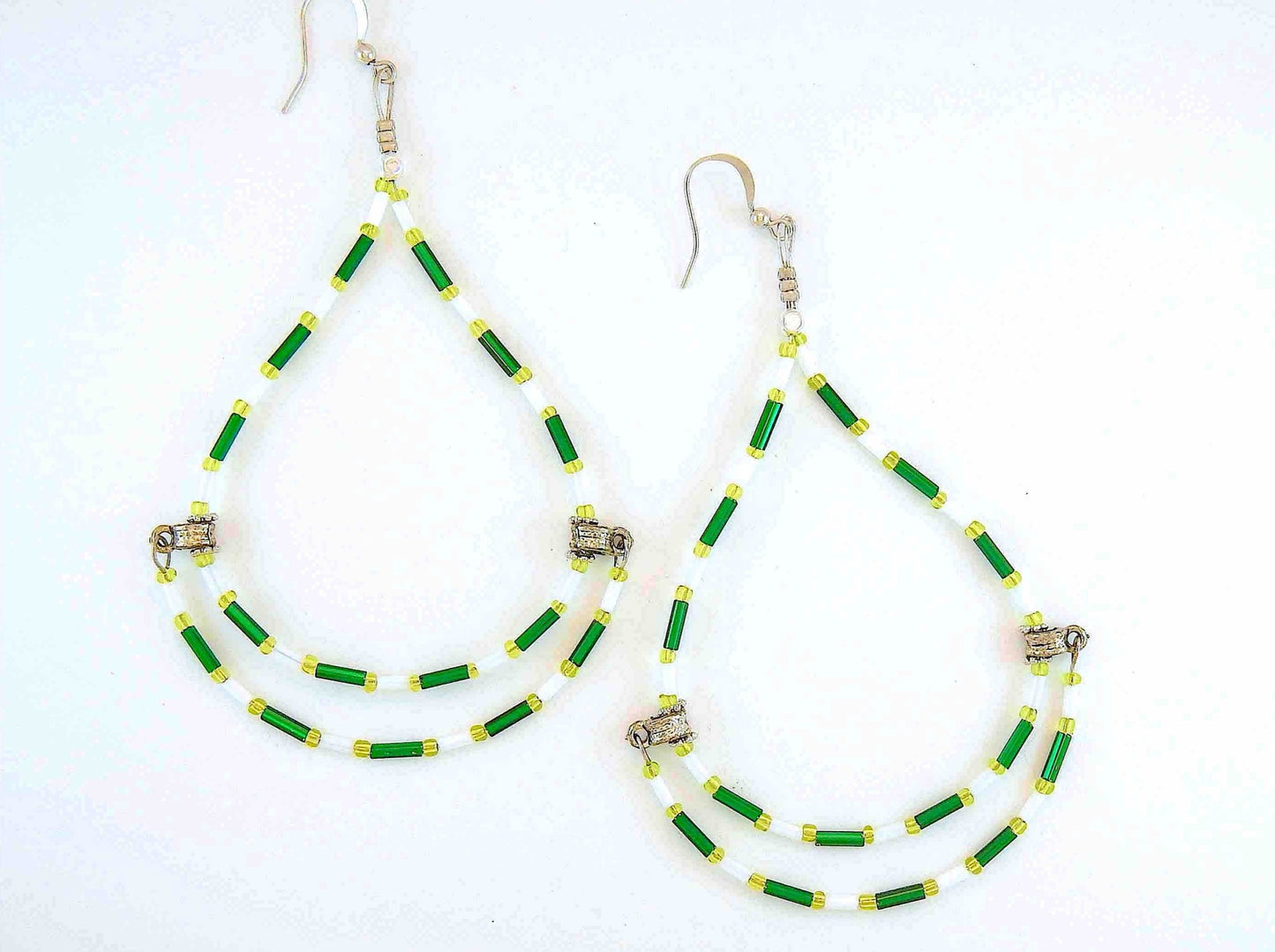 Long statement earrings with original hoop design in white and green, metal hooks