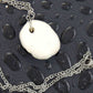 16-inch necklace with white ceramic knot pendant handmade in Montreal, stainless steel chain