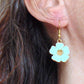 Short earrings with large enamelled hibiscus flowers in 5 colours (white, blue, lilac, pink, black), gold-toned stainless steel hooks