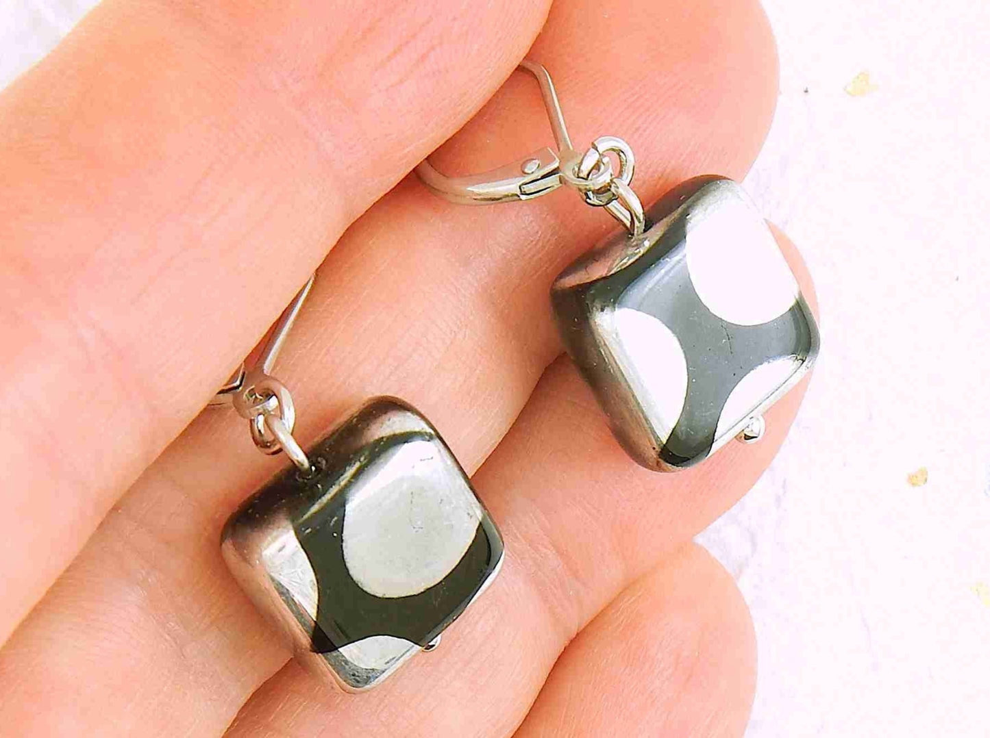 Short earrings with small shiny black Czech glass squares, large silver/copper/multicoloured dots, stainless steel lever back hooks