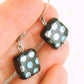 Short earrings with small shiny black Czech glass squares, small multicolored or copper dots, silver or rose gold-toned stainless steel lever back hooks