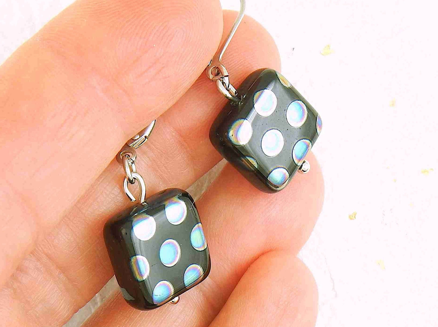 Short earrings with small shiny black Czech glass squares, small multicolored or copper dots, silver or rose gold-toned stainless steel lever back hooks