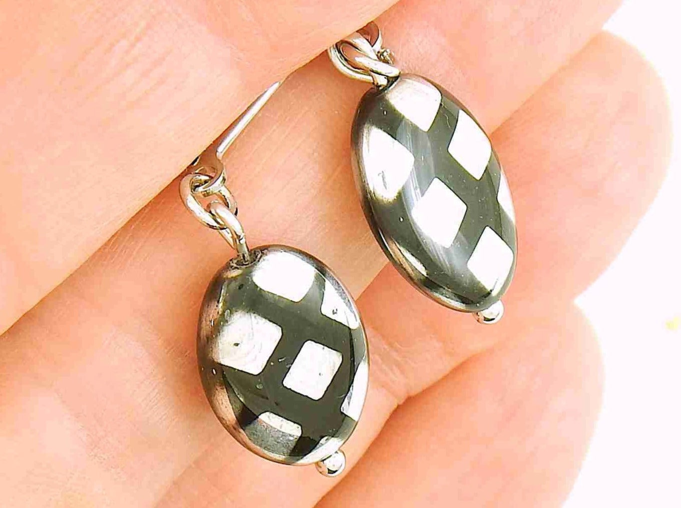 Short earrings with shiny black Czech glass ovals, choice of 2 patterns (multicoloured dots, silver criss-cross), stainless steel lever back hooks